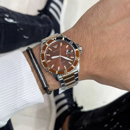 Emporio Armani Sea Explorer AR11340 two-tone watch worn on wrist with brown dial
