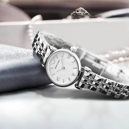Emporio Armani AR1763 watch styled on gray fabric with jewelry, white dial and silver bracelet