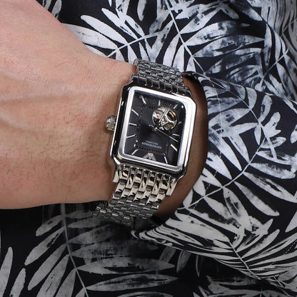 Emporio Armani Diego AR60057 automatic watch worn on wrist showing black dial and silver bracelet