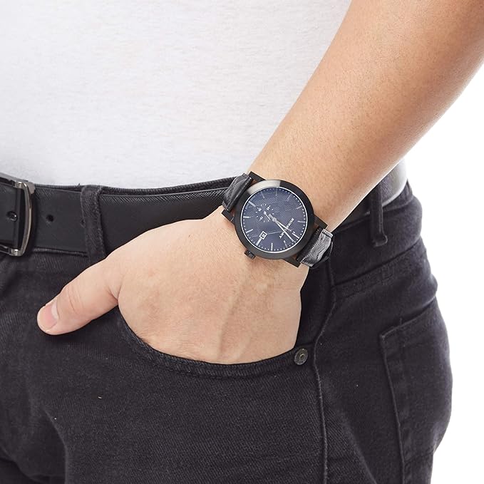 Burberry City watch worn on wrist showing black dial and leather strap