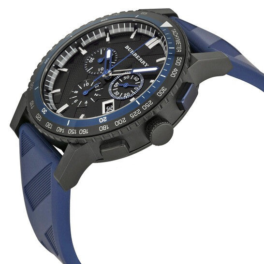 Three-quarter view of Burberry City Sport watch showing black case, dial, and blue rubber strap