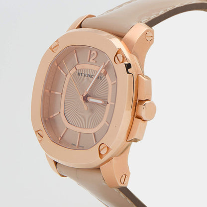 Three-quarter view of Burberry The Britain rose gold case with storm grey dial