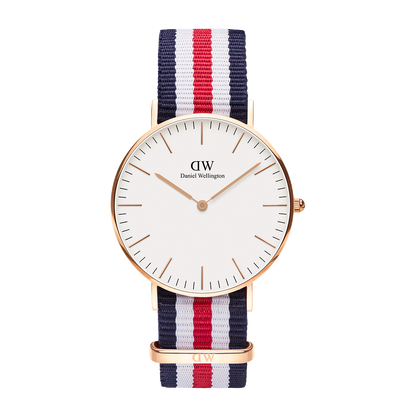 Front view of Daniel Wellington Canterbury 36mm gold watch with white dial and tricolour NATO strap