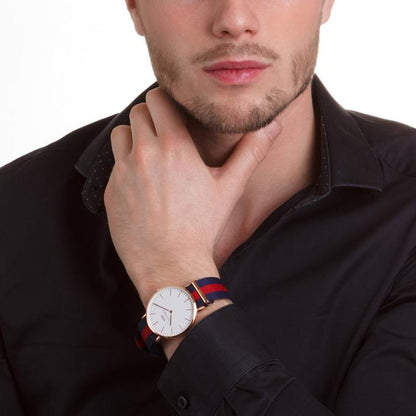 Daniel Wellington Classic Oxford gold watch worn on wrist, styled with black shirt