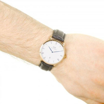 Dapper Reading 38mm watch worn on wrist showing gold case and black leather strap