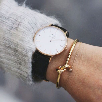 Daniel Wellington Sheffield 32mm watch worn on wrist with white dial and black leather strap