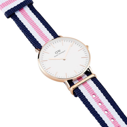 Daniel Wellington Southampton 36mm watch worn on wrist showing white dial, rose gold case, and tricolour fabric strap