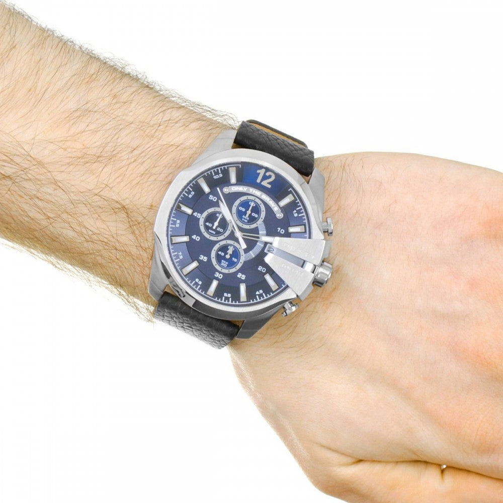 Diesel Mega Chief DZ4423 chronograph watch worn on wrist showing blue dial and silver case