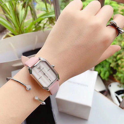 AR11207 worn on wrist with accessories, displaying rectangular case design