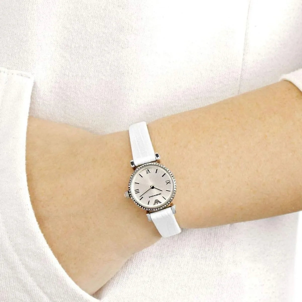 Emporio Armani Gianni T-Bar mini silver women's watch worn on wrist with white leather strap