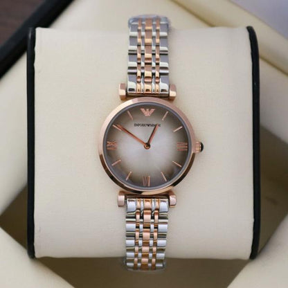 Emporio Armani AR1725 two-tone watch displayed on white wrist holder