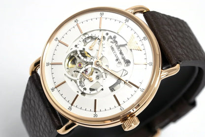 Angled front view of automatic skeleton watch with visible movement