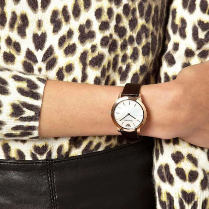 Emporio Armani Dino Slim AR1748 rose gold watch worn on wrist with dark leather strap