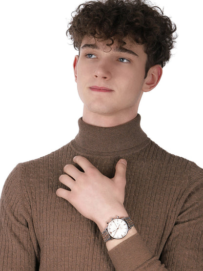 Emporio Armani Gianni XL two-tone chronograph watch worn on wrist against brown turtleneck