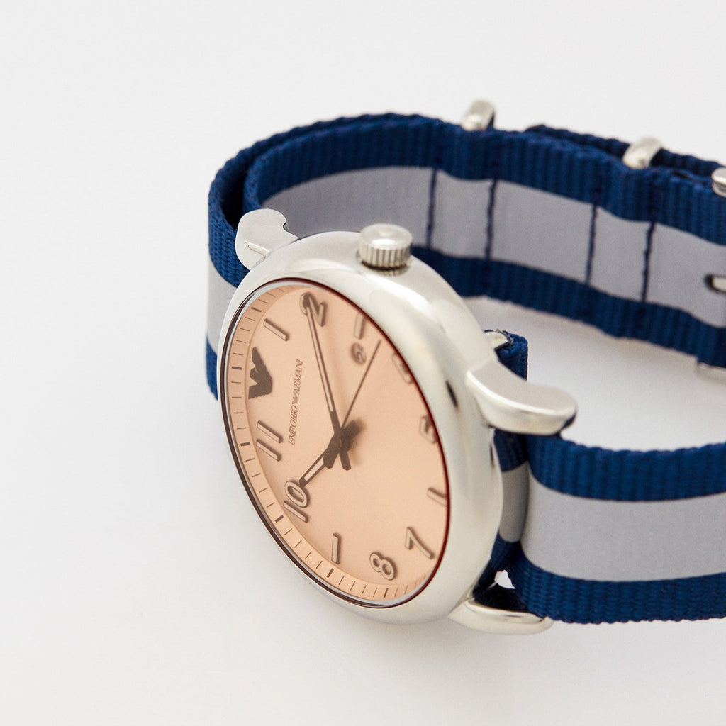 Close-up detail of Emporio Armani Luigi watch case and blue-grey striped strap