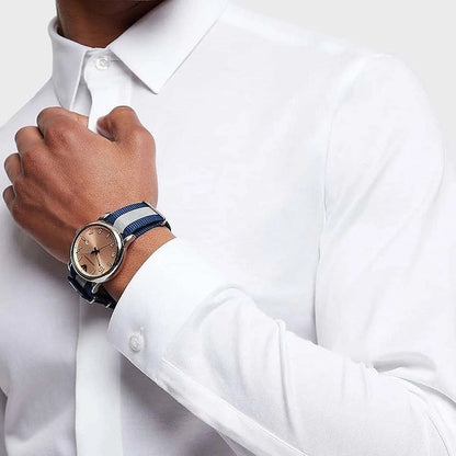 Emporio Armani Luigi men's watch worn on wrist with blue-grey striped strap
