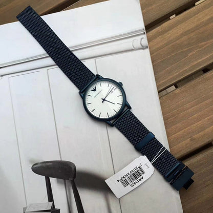 Emporio Armani Luigi watch laying flat showing white dial and blue mesh strap
