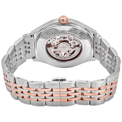 Caseback view of Emporio Armani Meccanico showing visible automatic movement and two-tone bracelet