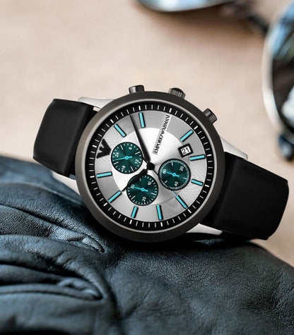 Emporio Armani Renato Chronograph on wrist showing silver case, white dial with teal subdials