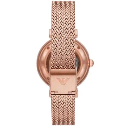 Rose gold caseback showing open movement and mesh strap attachment