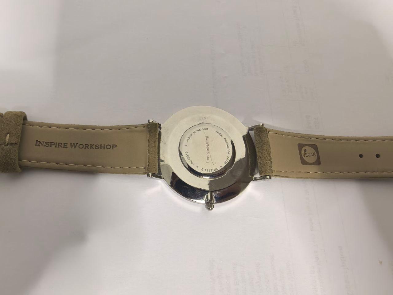Lorenzen Dilimi watch caseback with engraved text and leather strap