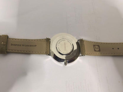 Lorenzen Dilimi watch caseback with engraved text and leather strap