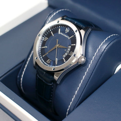 Angled view of Maserati Circuito watch showing blue dial and stainless steel bezel on blue cushion