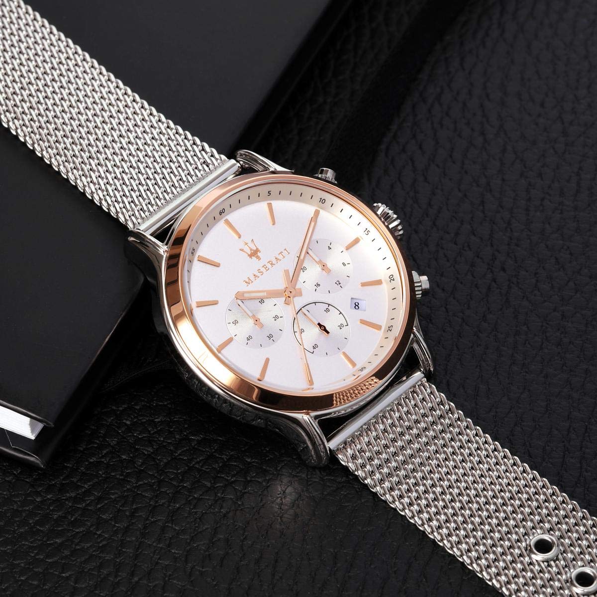 Maserati Epoca chronograph watch detail showing white dial with rose gold indices and chronograph functions