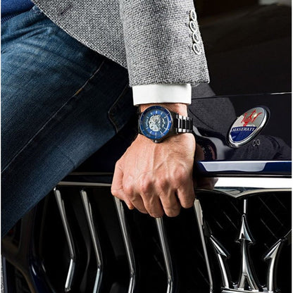 Maserati Sfida watch on wrist paired with Maserati car emblem and formal attire