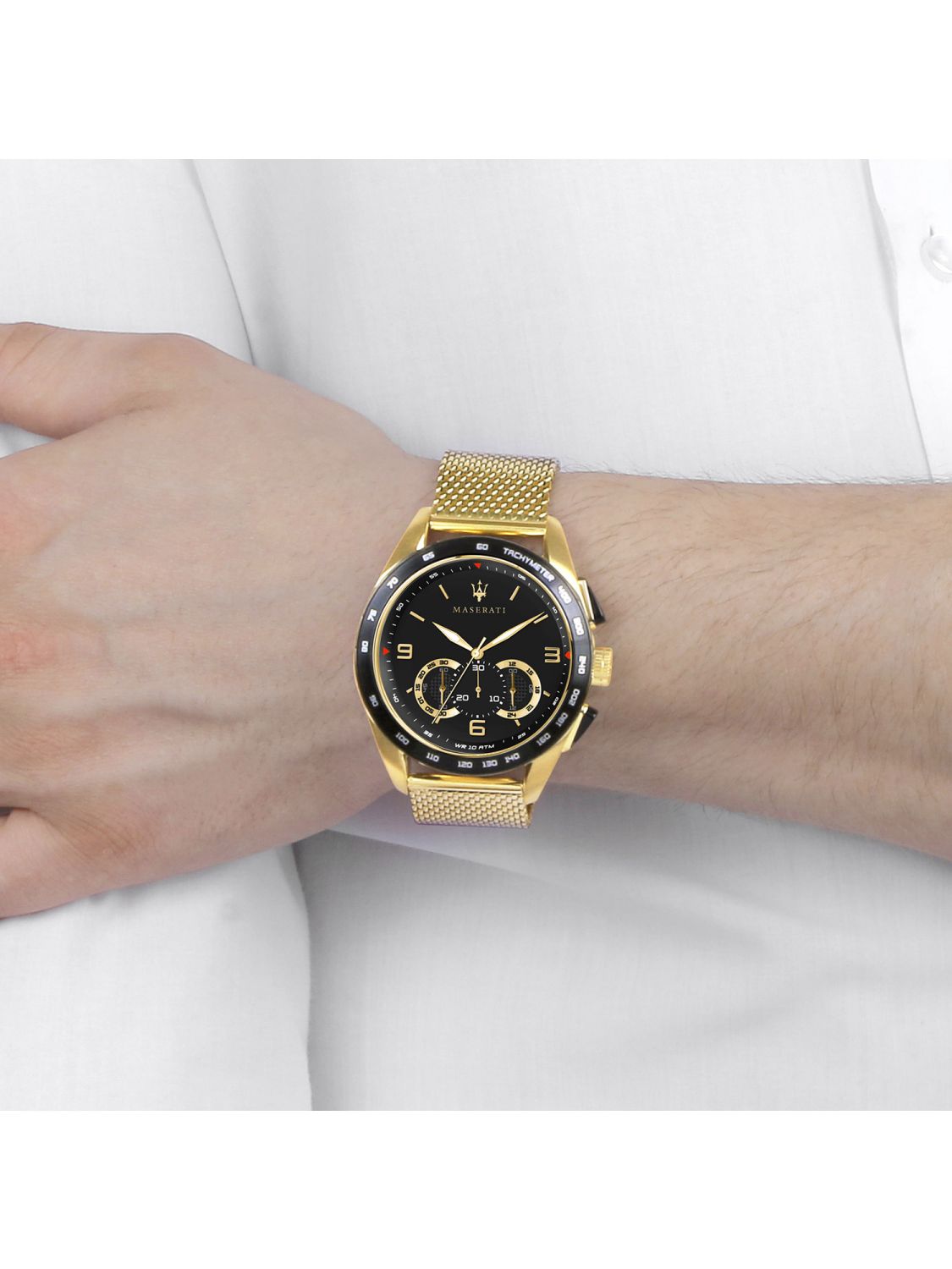 Maserati Traguardo chronograph watch worn on wrist with gold mesh bracelet