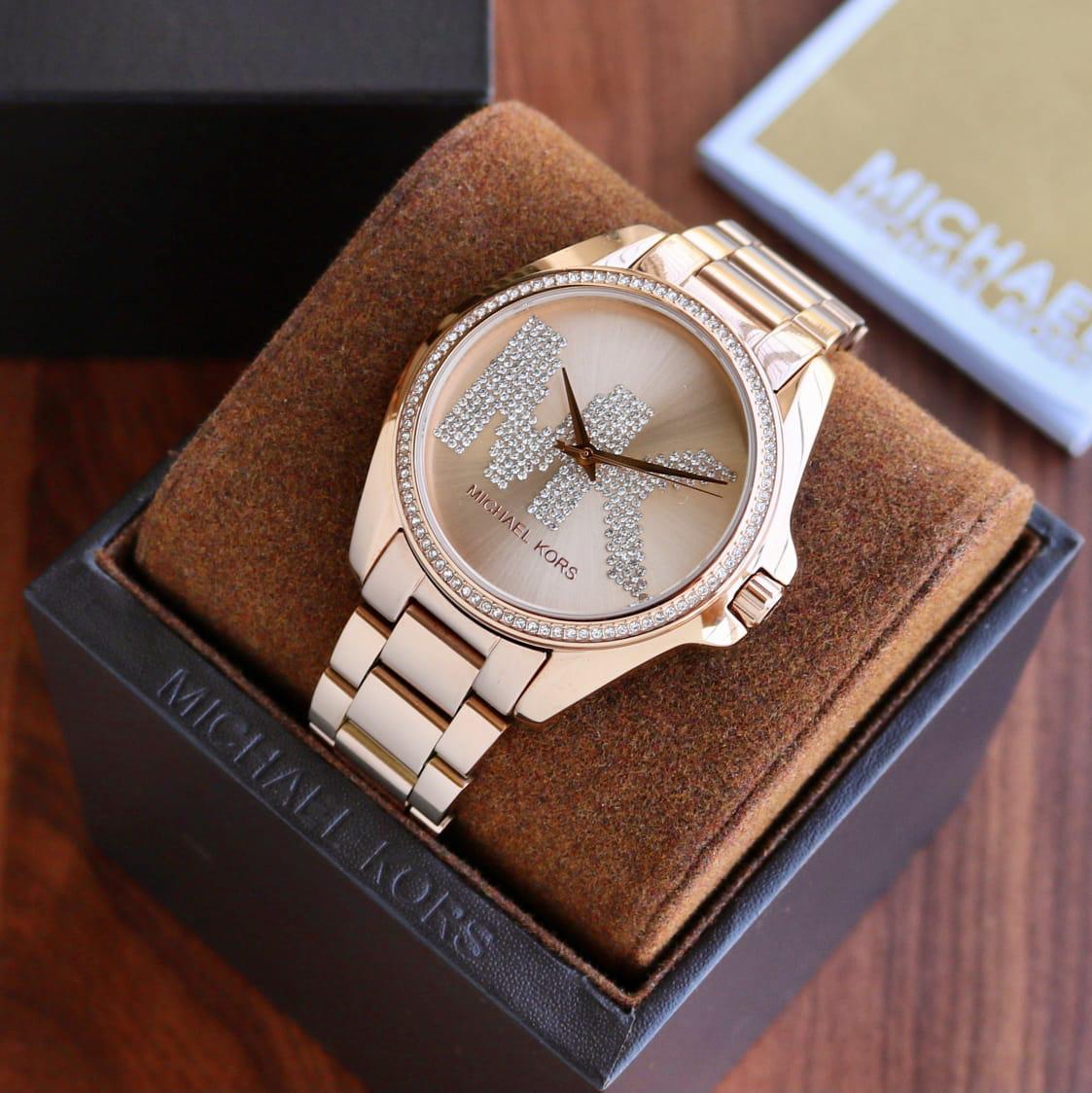 Michael Kors Bradshaw rose gold-tone women's watch on wrist with gift box