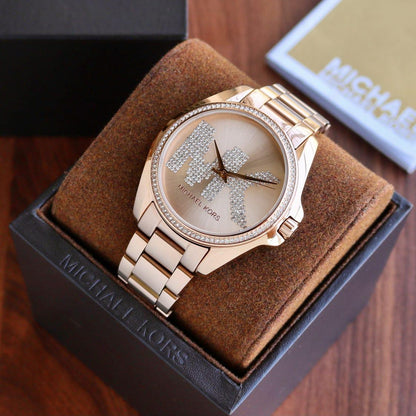 Michael Kors Bradshaw rose gold-tone women's watch on wrist with gift box