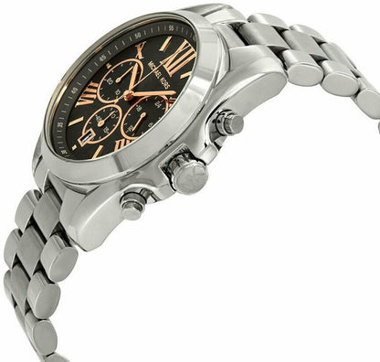 Angled view of Michael Kors Bradshaw watch showing grey dial with rose gold accents and stainless steel bracelet