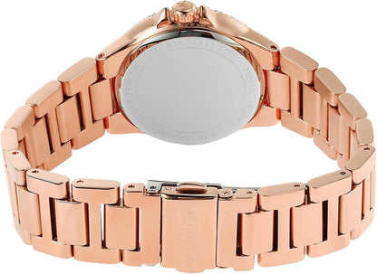Michael Kors Camille watch worn on wrist, displaying rose gold case and dark grey dial