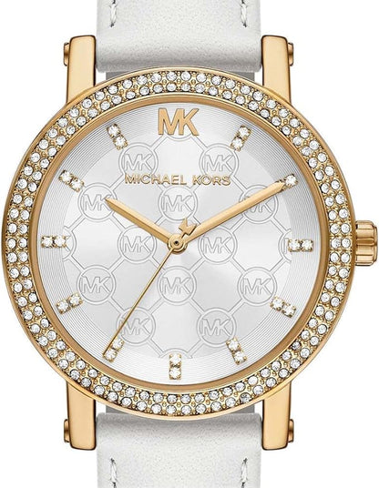 Close-up of Michael Kors Corey watch dial with MK logo, hour markers, and three-hand movement