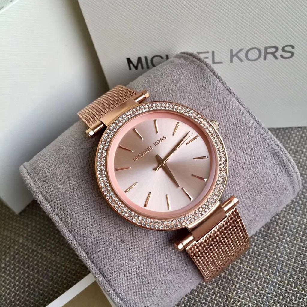 Michael Kors Darci rose gold mesh watch on wrist with original box