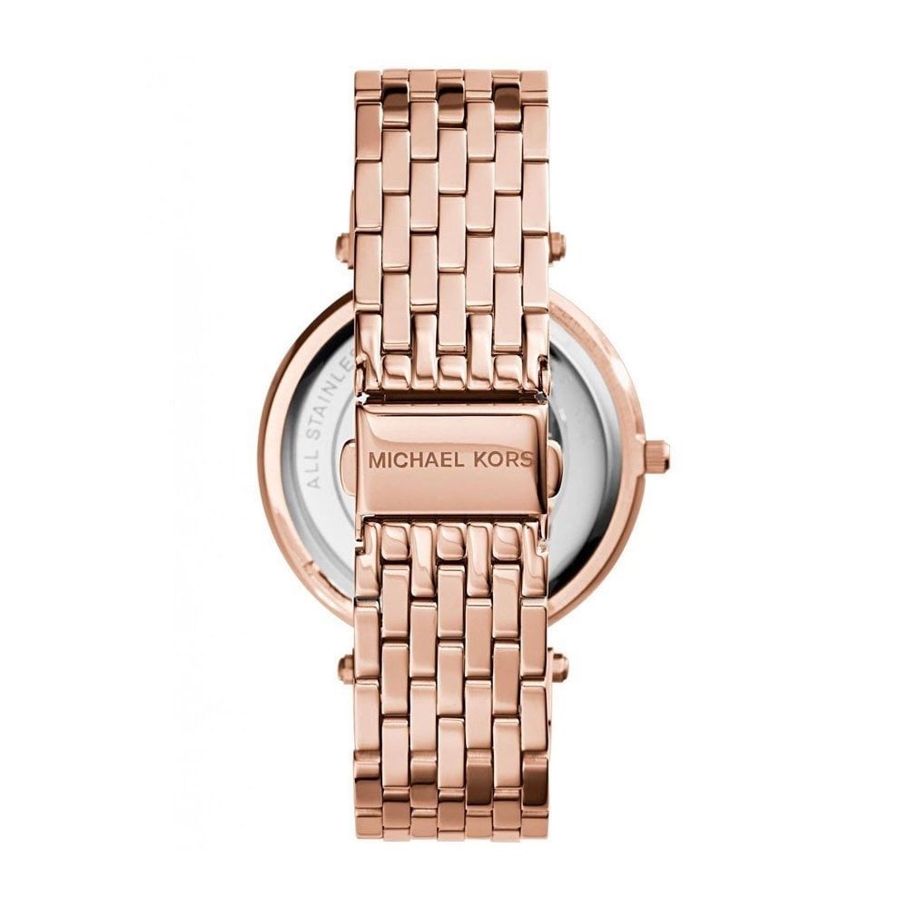 Caseback of Michael Kors Darci watch showing rose gold case with Michael Kors logo