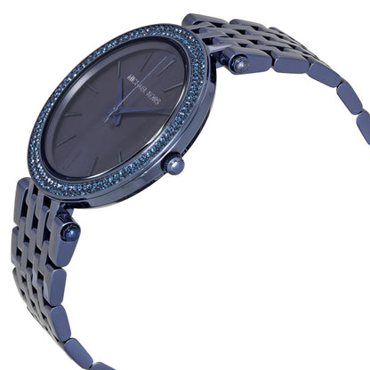 Michael Kors Darci watch shown at angle with blue dial and stainless steel bracelet