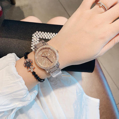 Michael Kors Darci Pave rose gold watch worn on wrist with crystal pave dial