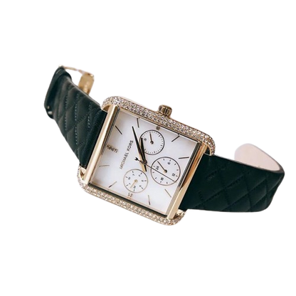Michael Kors Drew watch worn on wrist, displaying white dial with chronograph subdials