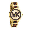 Michael Kors Janelle women's watch with gold case, tortoise brown acetate strap, and MK logo dial