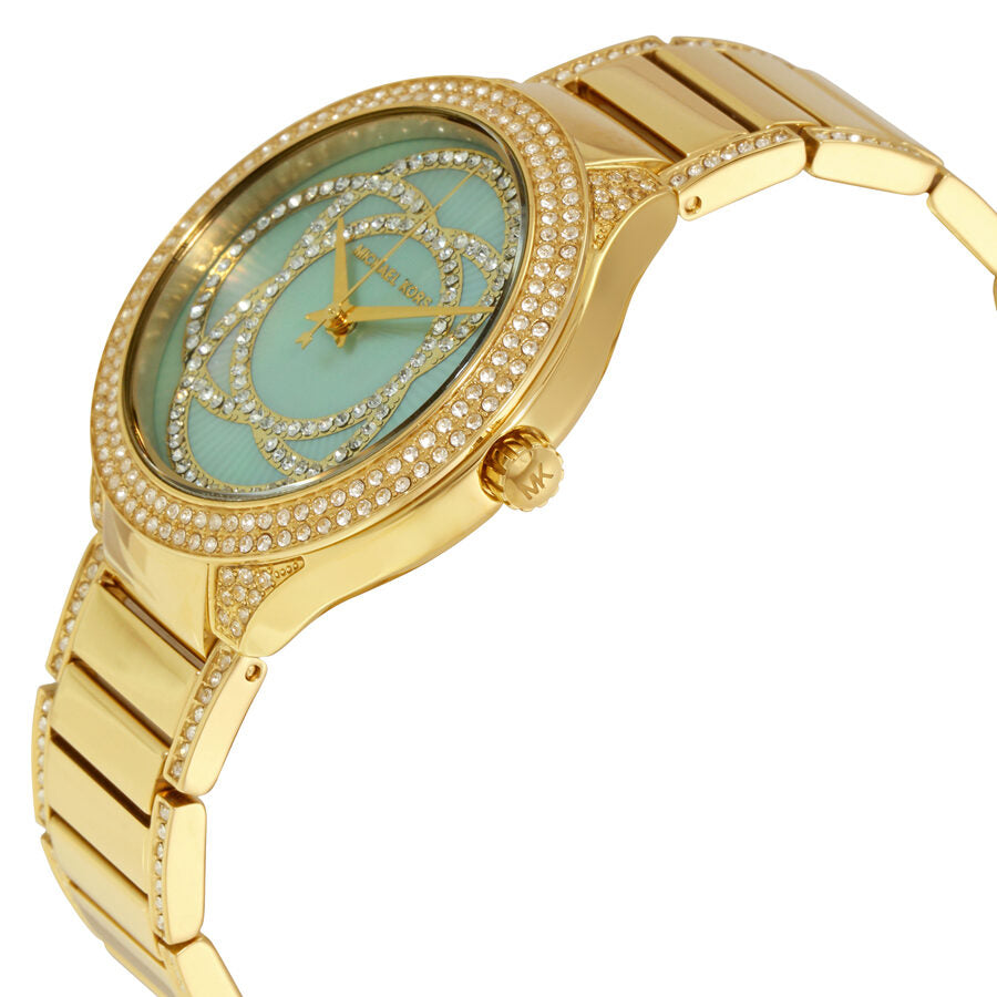 Michael Kors Kerry MK3481 angled view showing mint dial, crystal-set bezel, and gold bracelet