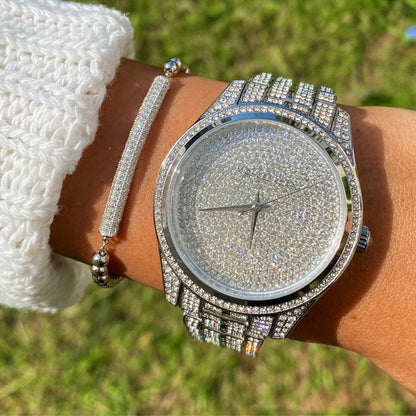 Michael Kors Lauryn Pave silver-tone watch worn on wrist with bracelet
