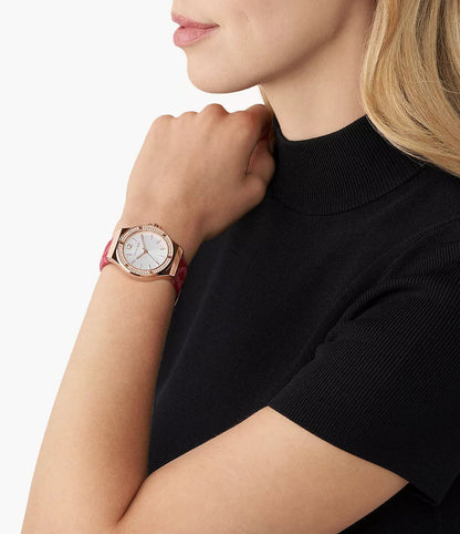 Michael Kors Lennox MK7308 watch worn on wrist, white dial with rose gold case and red leather strap