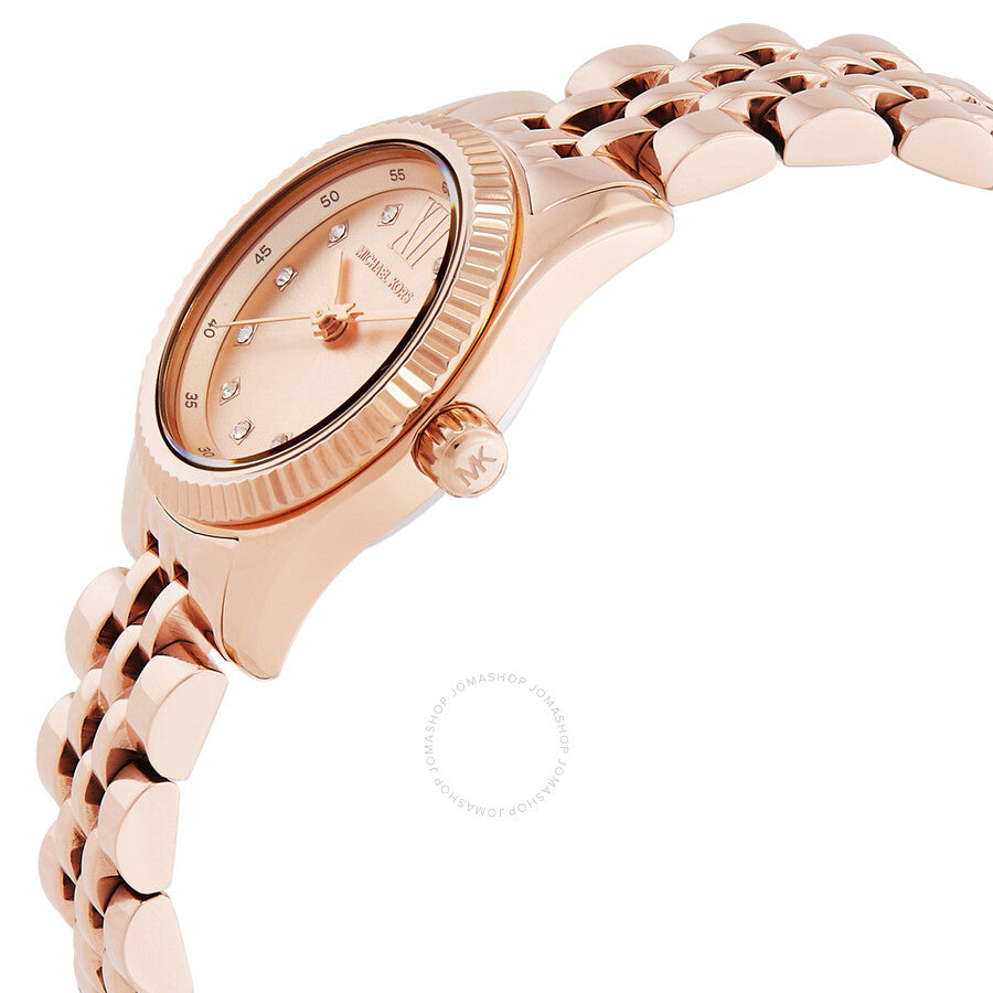 Side angle view of Michael Kors Lexington rose gold watch with bracelet