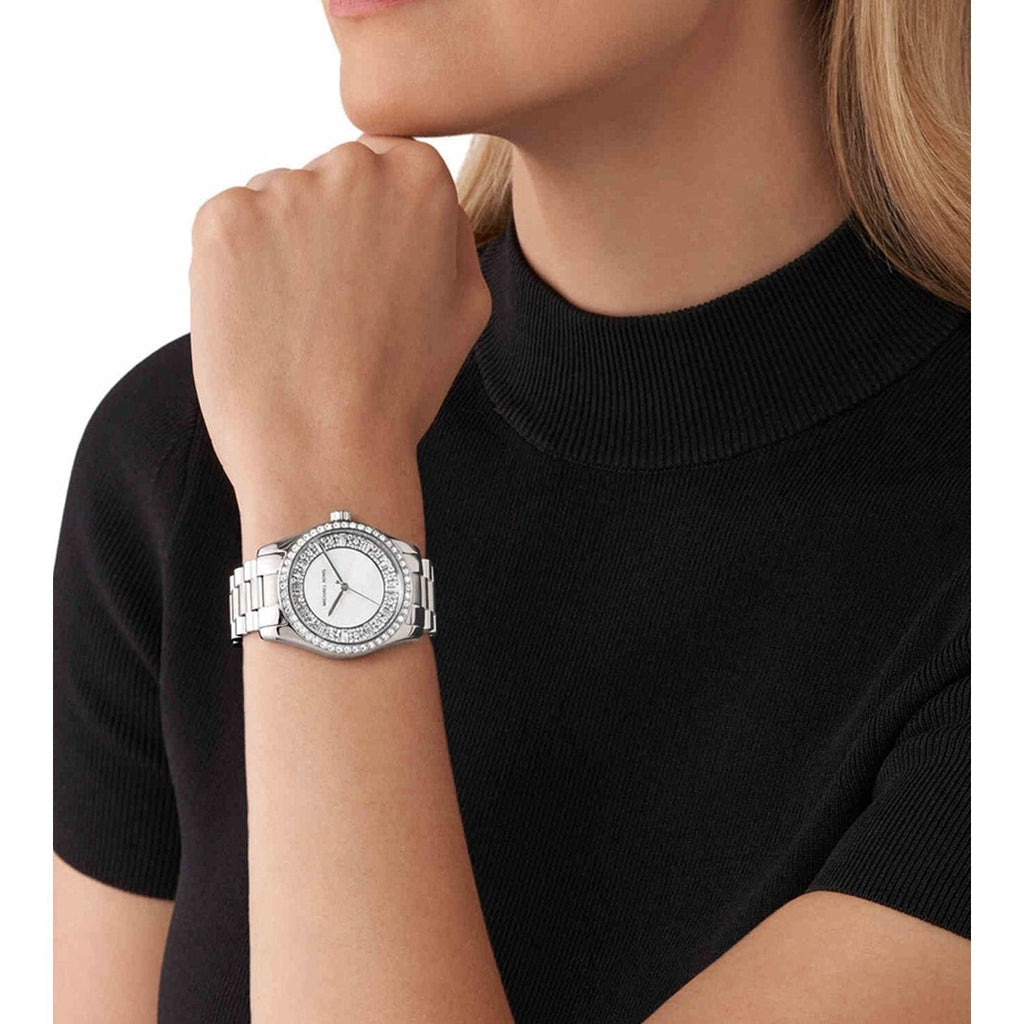 Michael Kors Lexington watch worn on wrist with mother-of-pearl dial visible
