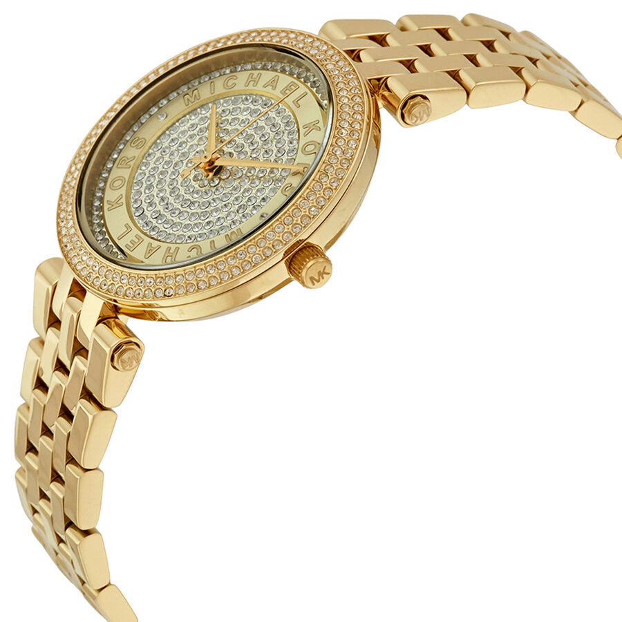 Side angle view of Michael Kors Mini Darci watch showing crystal pave dial and gold bracelet
