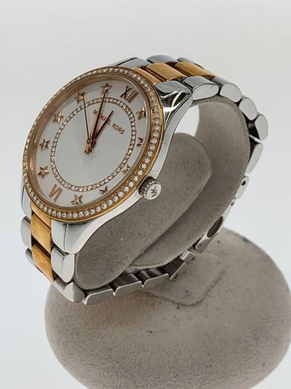 Side angle view of Michael Kors MK4483 watch on display stand