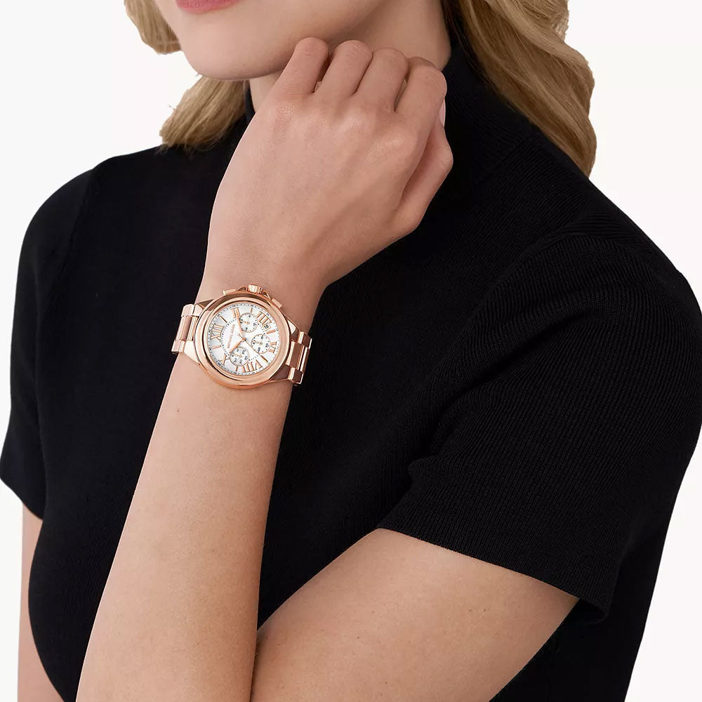 Michael Kors Camille chronograph watch worn on wrist with white dial and rose-gold case