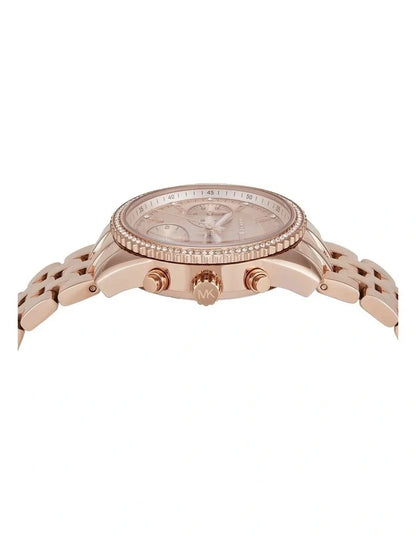 Side profile of rose-gold Mini Bryant chronograph showing case, crystal bezel, and chronograph pushers